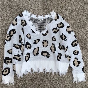 Women’s Frayed Cheetah Print Sweater. Size M